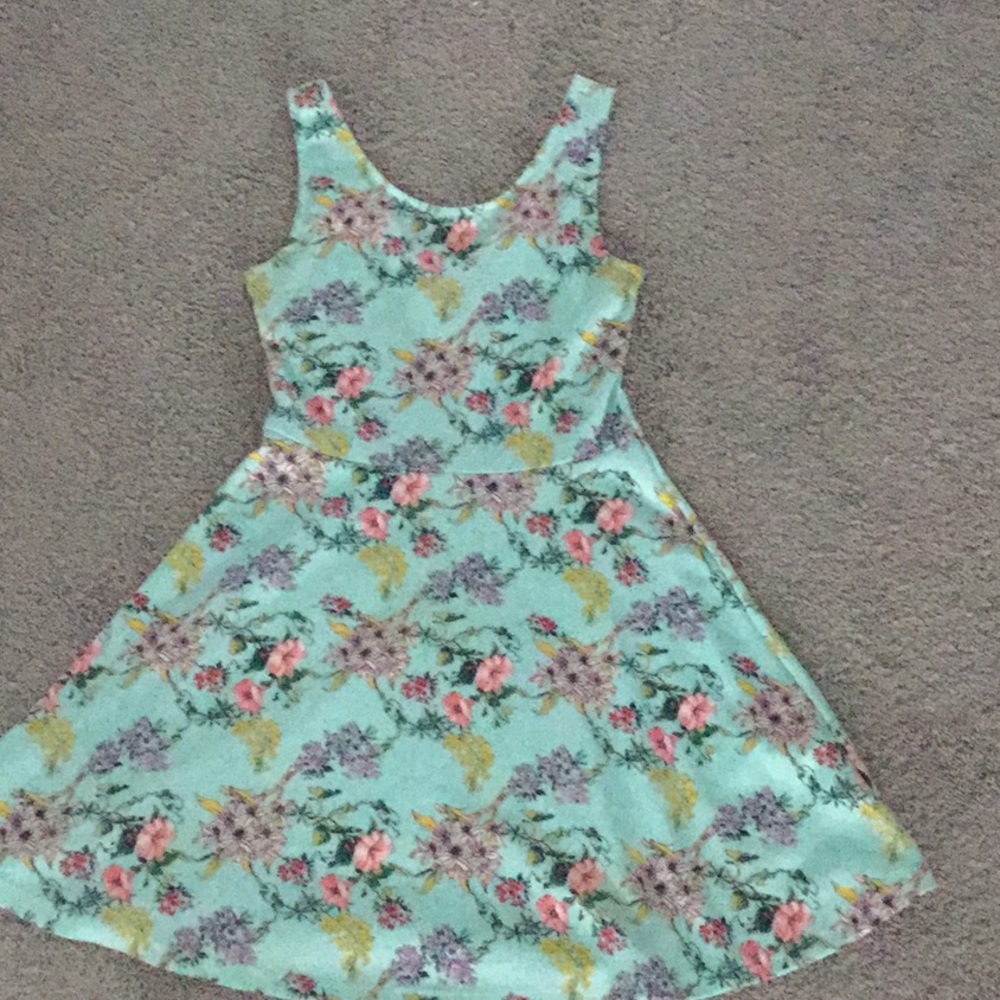 A blue dress with flowers on it